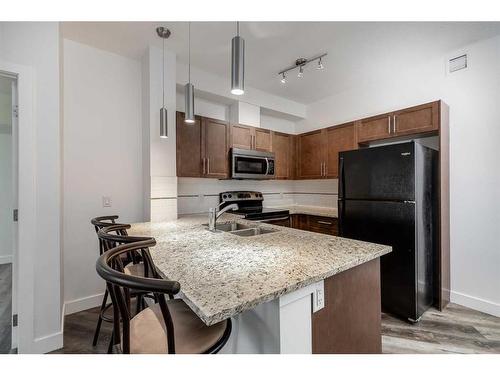 2115-604 East Lake Boulevard Se, Airdrie, AB - Indoor Photo Showing Kitchen With Double Sink