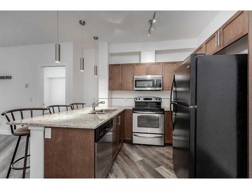 2115-604 East Lake Boulevard Se, Airdrie, AB - Indoor Photo Showing Kitchen With Stainless Steel Kitchen With Double Sink With Upgraded Kitchen