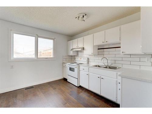 4851 Mardale Road Ne, Calgary, AB - Indoor Photo Showing Kitchen With Double Sink