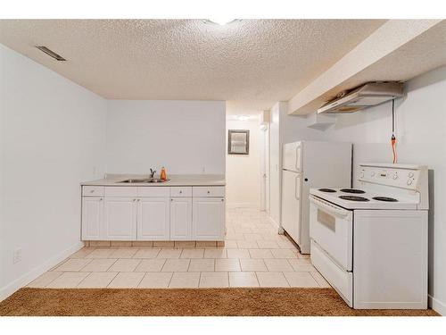 4851 Mardale Road Ne, Calgary, AB - Indoor Photo Showing Kitchen With Double Sink