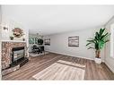 3420 Button Road Nw, Calgary, AB  - Indoor Photo Showing Living Room With Fireplace 