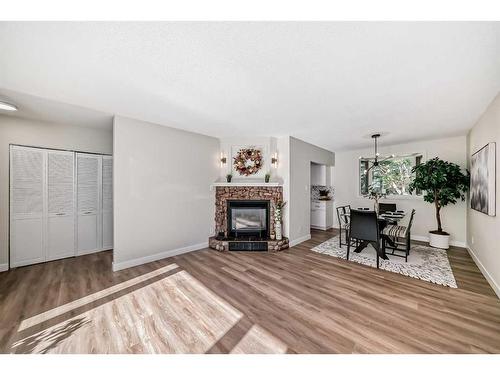 3420 Button Road Nw, Calgary, AB - Indoor Photo Showing Living Room With Fireplace