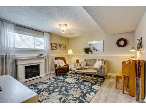 940 Woodside Lane Nw, Airdrie, AB - Indoor Photo Showing Living Room With Fireplace