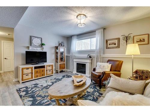 940 Woodside Lane Nw, Airdrie, AB - Indoor Photo Showing Living Room With Fireplace