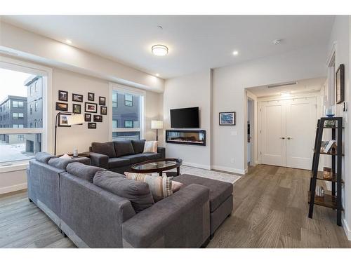 202-235 Lebel Crescent Nw, Calgary, AB - Indoor Photo Showing Living Room