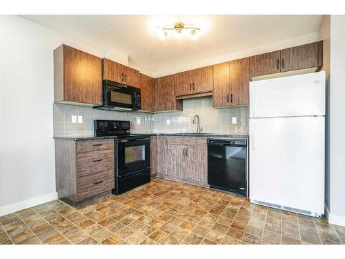 906-250 Sage Valley Road Nw, Calgary, AB - Indoor Photo Showing Kitchen