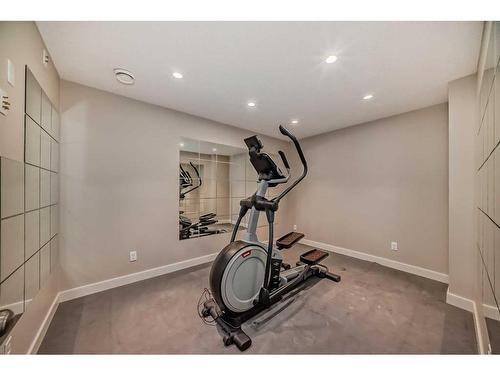 50 Aspen Hills Way Sw, Calgary, AB - Indoor Photo Showing Gym Room