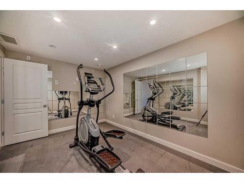 50 Aspen Hills Way Sw, Calgary, AB - Indoor Photo Showing Gym Room