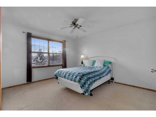 15894 Everstone Road Sw, Calgary, AB - Indoor Photo Showing Bedroom