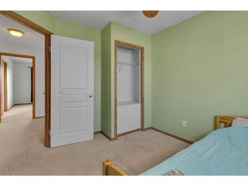 15894 Everstone Road Sw, Calgary, AB - Indoor Photo Showing Bedroom