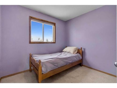 15894 Everstone Road Sw, Calgary, AB - Indoor Photo Showing Bedroom