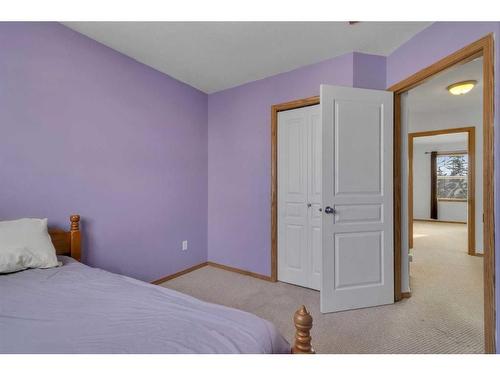 15894 Everstone Road Sw, Calgary, AB - Indoor Photo Showing Bedroom