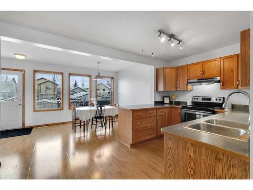 15894 Everstone Road Sw, Calgary, AB - Indoor Photo Showing Kitchen With Double Sink