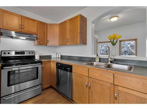 15894 Everstone Road Sw, Calgary, AB - Indoor Photo Showing Kitchen With Double Sink