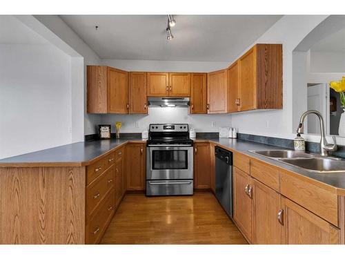 15894 Everstone Road Sw, Calgary, AB - Indoor Photo Showing Kitchen With Double Sink