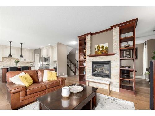 138 Aspen Stone Grove Sw, Calgary, AB - Indoor Photo Showing Living Room With Fireplace