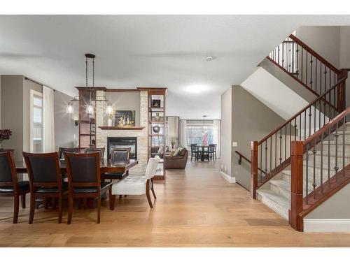 138 Aspen Stone Grove Sw, Calgary, AB - Indoor Photo Showing Dining Room With Fireplace