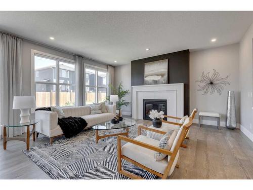 320 Legacy Circle Se, Calgary, AB - Indoor Photo Showing Living Room With Fireplace