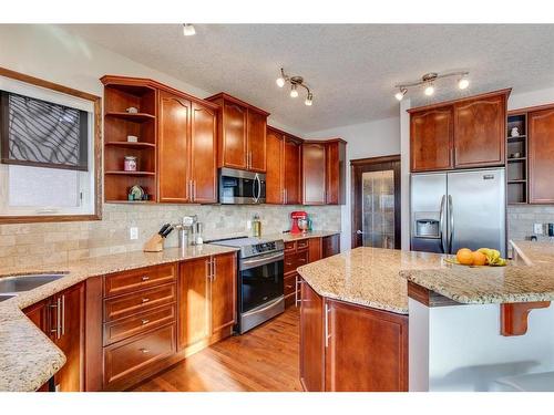 7 Aspen Stone Way Sw, Calgary, AB - Indoor Photo Showing Kitchen With Stainless Steel Kitchen With Upgraded Kitchen