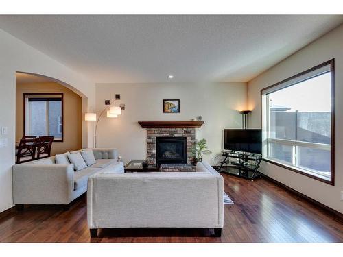 7 Aspen Stone Way Sw, Calgary, AB - Indoor Photo Showing Living Room With Fireplace