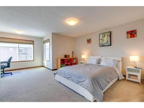 7 Aspen Stone Way Sw, Calgary, AB - Indoor Photo Showing Bedroom