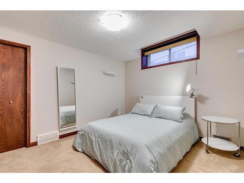 7 Aspen Stone Way Sw, Calgary, AB - Indoor Photo Showing Bedroom