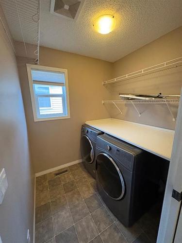 96 Drake Landing Crescent, Okotoks, AB - Indoor Photo Showing Laundry Room