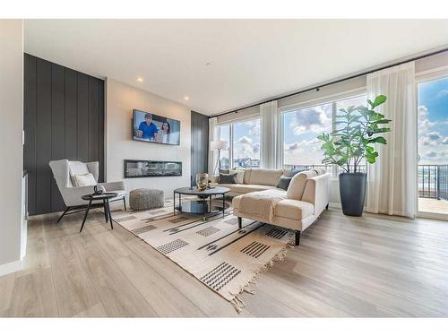 429 Cranbrook Gardens Se, Calgary, AB - Indoor Photo Showing Living Room With Fireplace