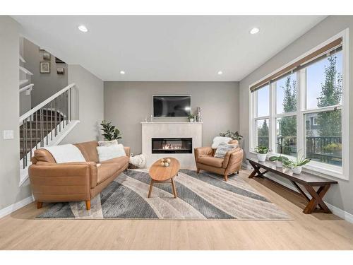 18 Masters Villas Se, Calgary, AB - Indoor Photo Showing Living Room With Fireplace