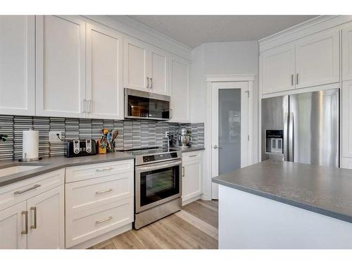 113 Cranleigh Bay Se, Calgary, AB - Indoor Photo Showing Kitchen With Upgraded Kitchen