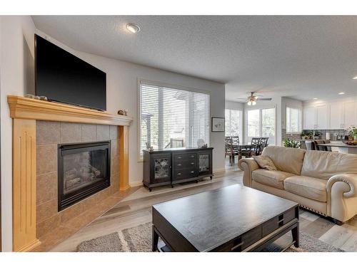 113 Cranleigh Bay Se, Calgary, AB - Indoor Photo Showing Living Room With Fireplace