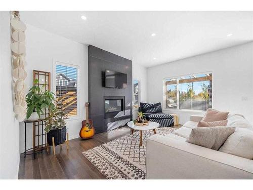 277 Willow Park, Cochrane, AB - Indoor Photo Showing Living Room With Fireplace