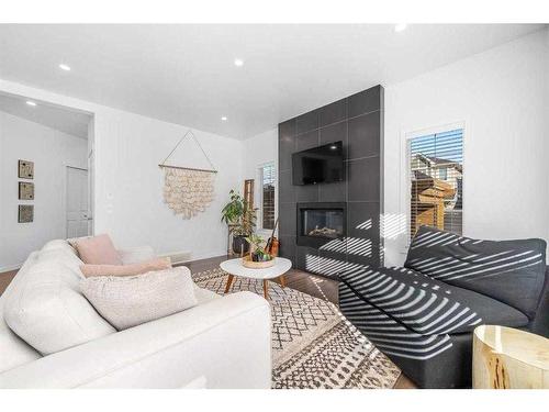 277 Willow Park, Cochrane, AB - Indoor Photo Showing Living Room With Fireplace