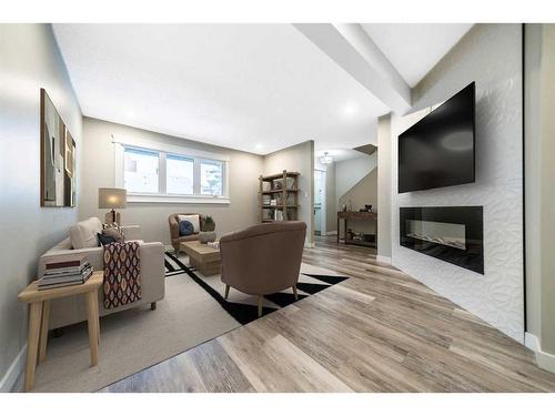 503-4935 Dalton Drive Nw, Calgary, AB - Indoor Photo Showing Living Room With Fireplace