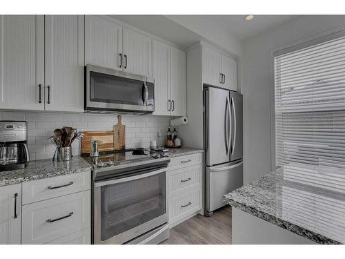 8141 Masters Boulevard Se, Calgary, AB - Indoor Photo Showing Kitchen With Stainless Steel Kitchen With Upgraded Kitchen