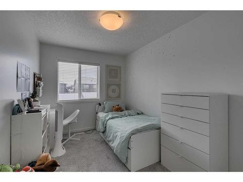 8141 Masters Boulevard Se, Calgary, AB - Indoor Photo Showing Bedroom