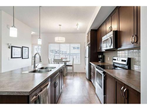 587 Mahogany Boulevard Se, Calgary, AB - Indoor Photo Showing Kitchen With Double Sink With Upgraded Kitchen