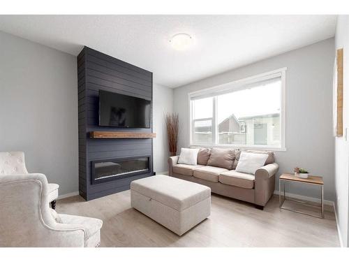 786 Walden Drive Se, Calgary, AB - Indoor Photo Showing Living Room With Fireplace