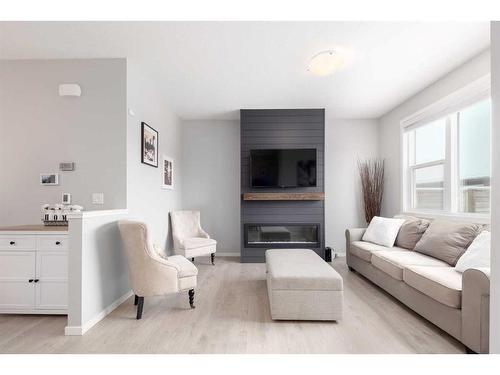 786 Walden Drive Se, Calgary, AB - Indoor Photo Showing Living Room With Fireplace