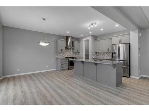 114 Osborne Common Sw, Airdrie, AB - Indoor Photo Showing Kitchen With Upgraded Kitchen