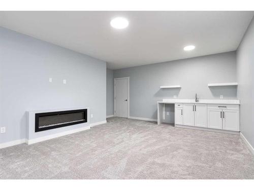 902 Macleod Trail Sw, High River, AB - Indoor With Fireplace