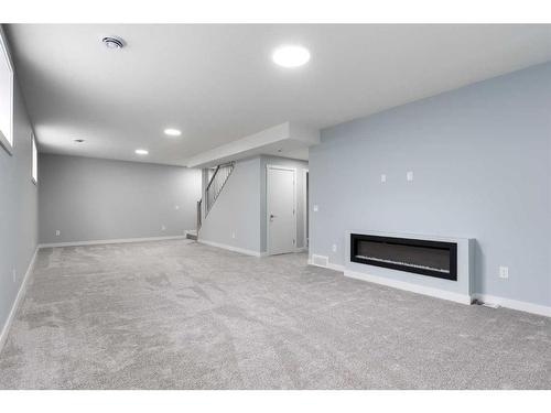 902 Macleod Trail Sw, High River, AB - Indoor With Fireplace