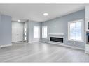 902 Macleod Trail Sw, High River, AB  - Indoor Photo Showing Living Room With Fireplace 