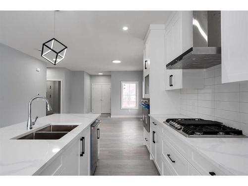 902 Macleod Trail Sw, High River, AB - Indoor Photo Showing Kitchen With Double Sink With Upgraded Kitchen