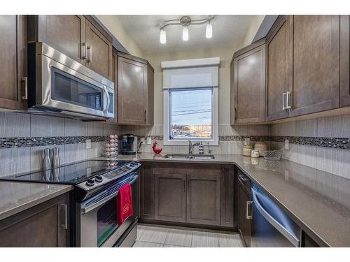 302-16 Varsity Estates Circle Nw, Calgary, AB - Indoor Photo Showing Kitchen With Stainless Steel Kitchen With Double Sink