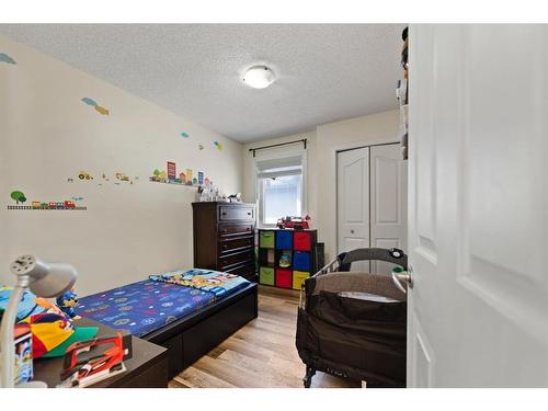 213 Saddlecrest Place Ne, Calgary, AB - Indoor Photo Showing Bedroom