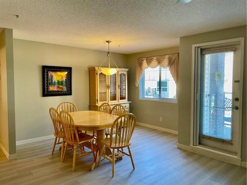 1108-928 Arbour Lake Road Nw, Calgary, AB - Indoor Photo Showing Dining Room