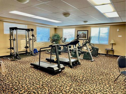 1108-928 Arbour Lake Road Nw, Calgary, AB - Indoor Photo Showing Gym Room