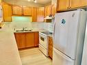 1108-928 Arbour Lake Road Nw, Calgary, AB  - Indoor Photo Showing Kitchen With Double Sink 