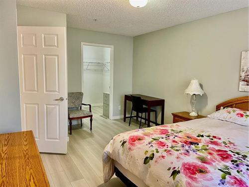 1108-928 Arbour Lake Road Nw, Calgary, AB - Indoor Photo Showing Bedroom